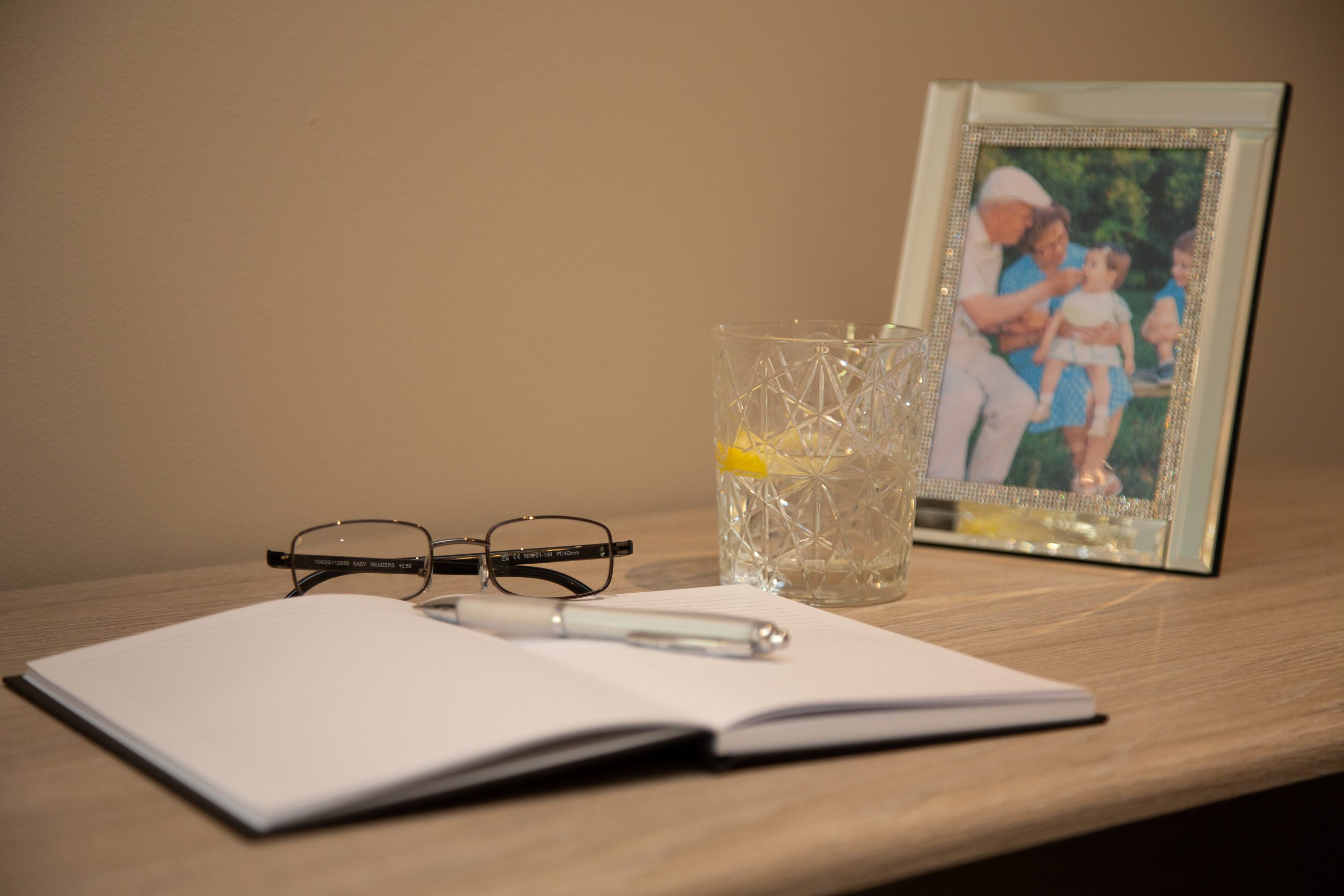 Care home desk with book and photo frame